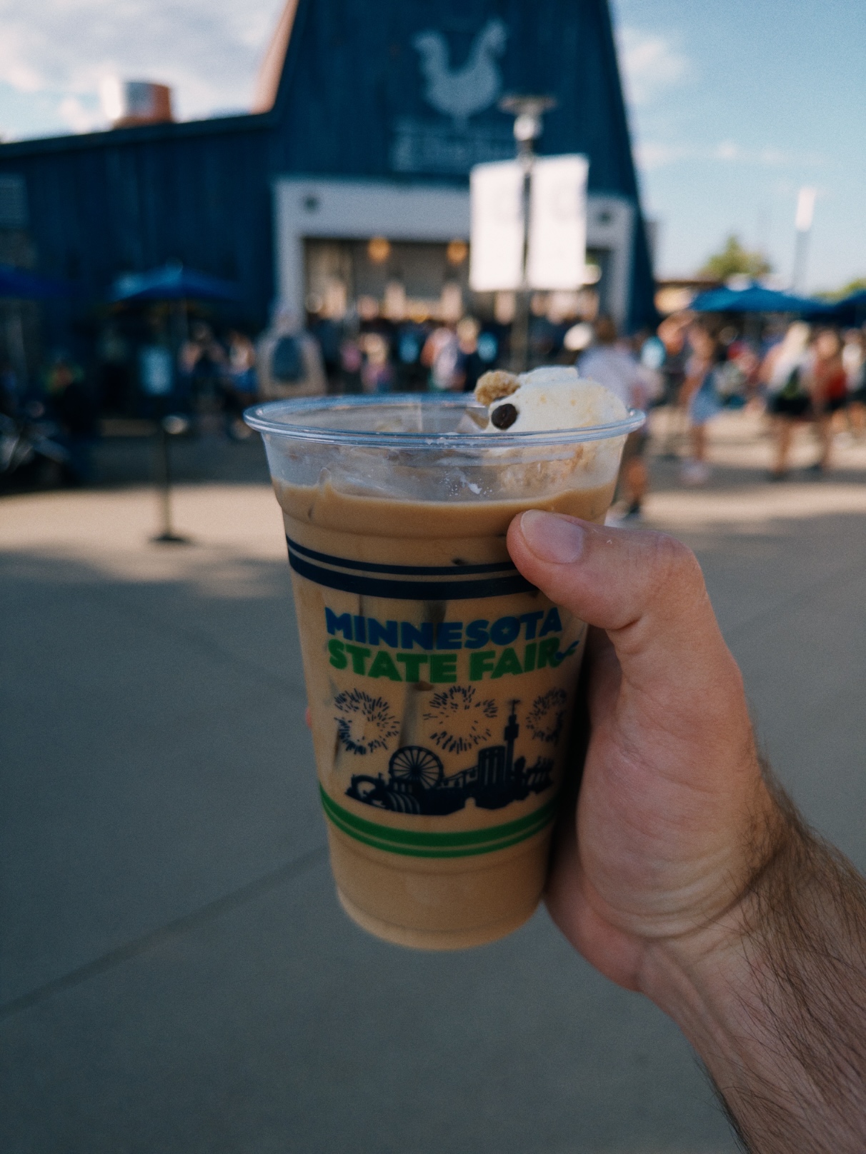 Pale iced coffee topped with a small marshmallow