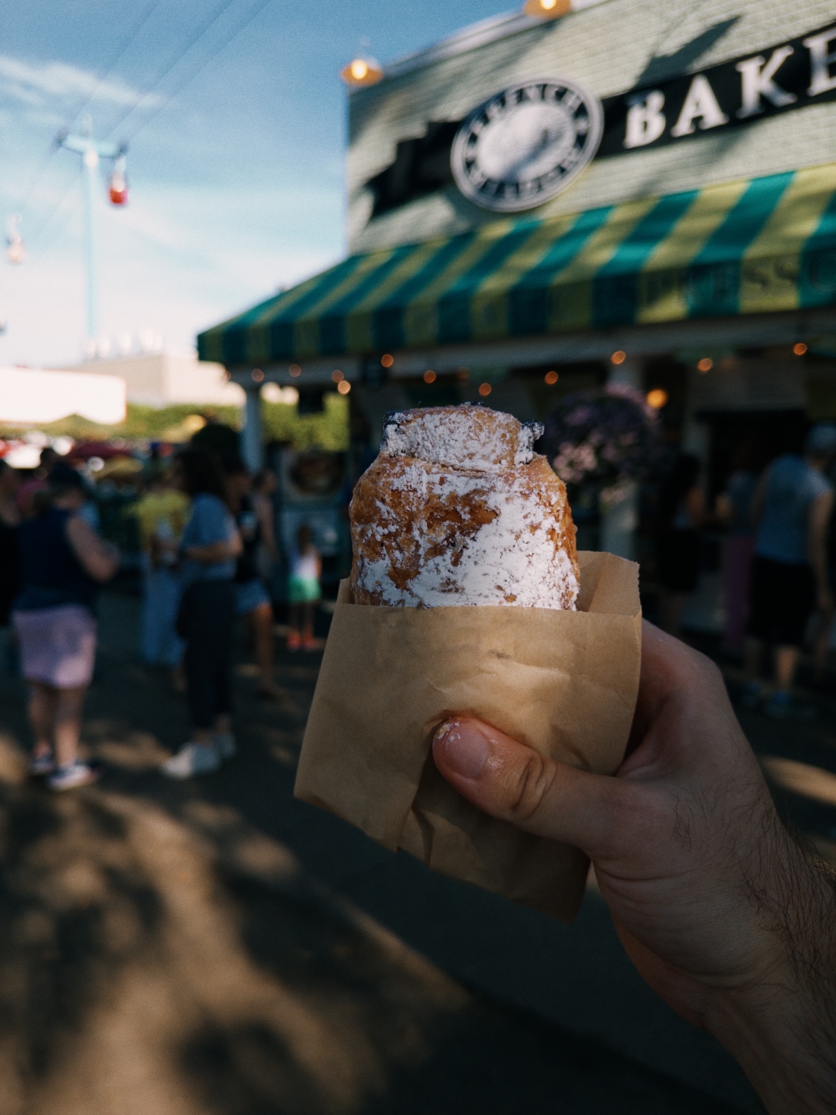 Square flaky pastry dusted generously with powdered sugar