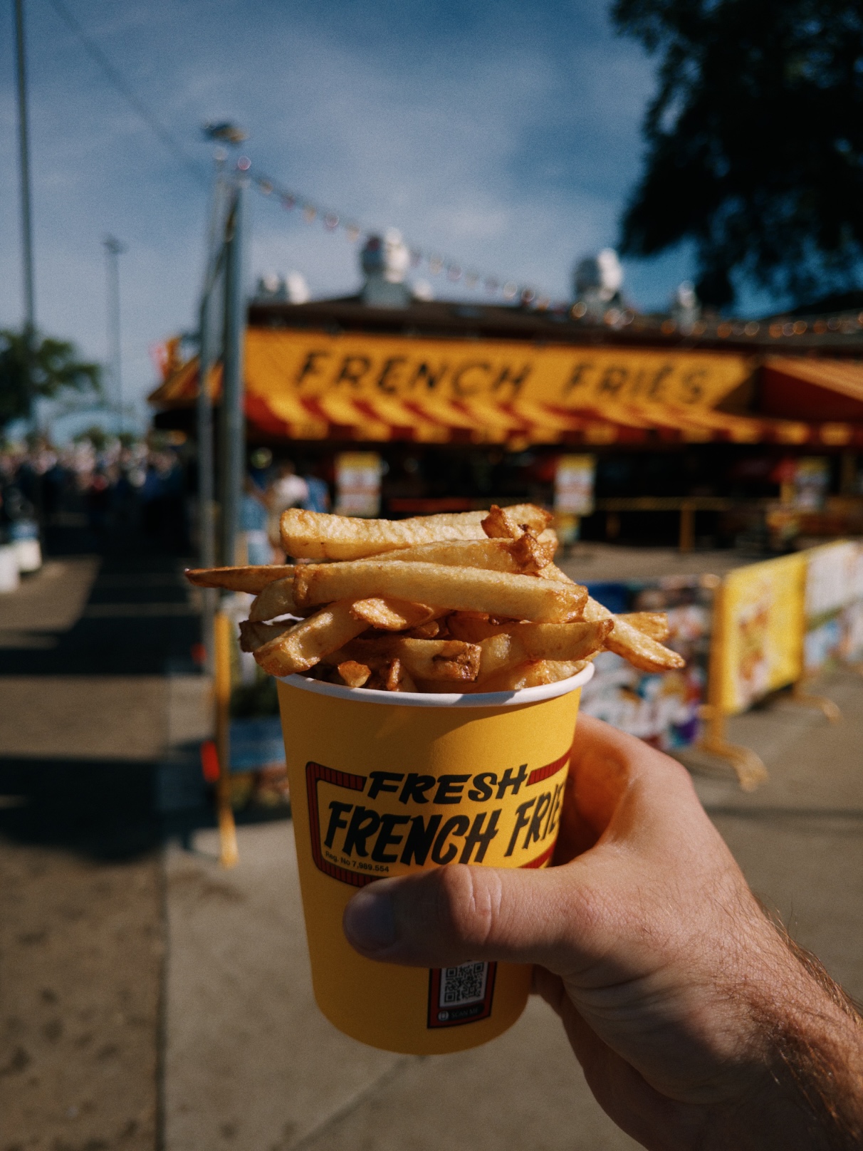 Cup overflowing with thick, golden french fries