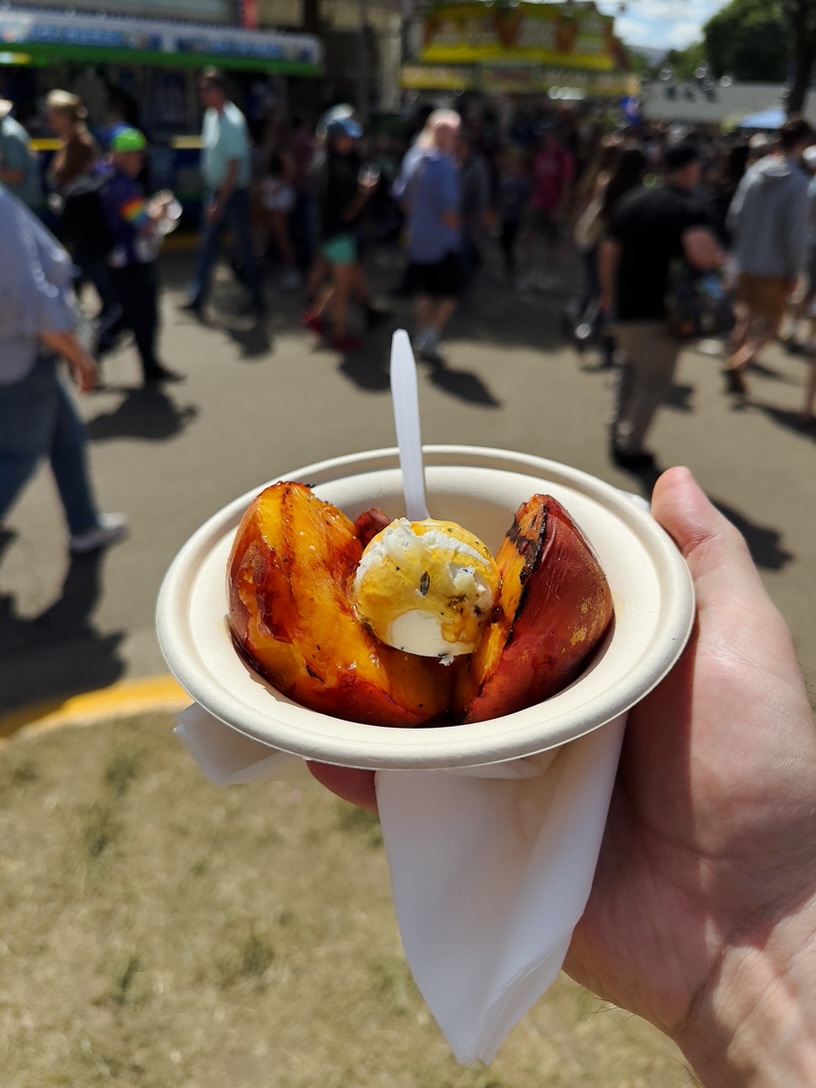 A grilled peach with honey and goat butter