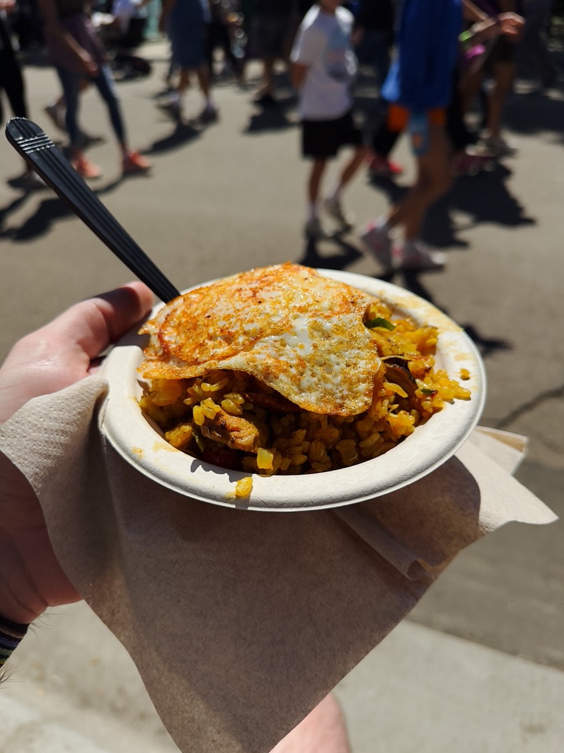 Chicken and chorizo paella topped with a fried egg